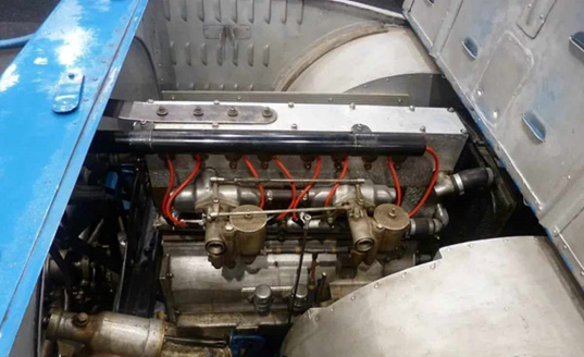 Engine 58 in the car, 2024. The round cam-cover nuts match the 1923 period photographs, confirming this is the original engine. From the Perridon Collection Type 32 dossier.