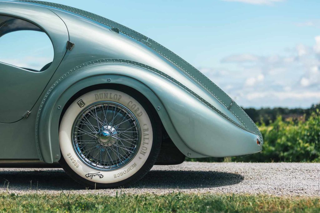 Rear haunch and Dunlop wheel — every seam riveted.